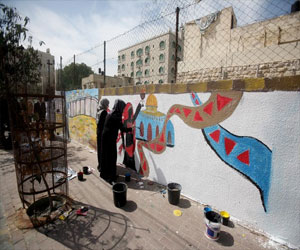   مصر اليوم - غزة تُحيي يوم المرأة بجداريات المعاناة والنضال