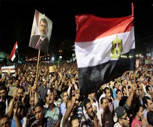   مصر اليوم - أنصار مرسي يغادرون الحرس الجمهوري إلي رابعة