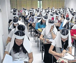 مصر اليوم - قبعات مضادة للغش في جامعة تايلاندية تثير انتقادات