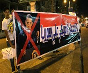   مصر اليوم - وقفة احتجاجية وسلاسل بشرية في السويس تنديدًا بتلويح أميركا بضرب سورية