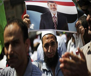   مصر اليوم - تظاهرات في محيط أكاديميَّة الشُّرطة قبل محاكمة مرسي