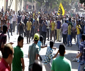   مصر اليوم - إشتباكات بين أنصار مرسي ومعارضيه في القاهرة تسفر عن إصابات