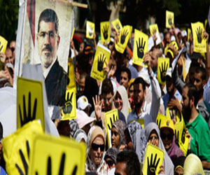 مصر اليوم - سلسلة بشريَّة لأنصار مرسي في برج العرب