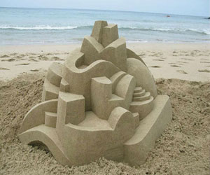   مصر اليوم - الفنان الأميركي سيبرت يشكيل بالرمال على شواطئ هاواي