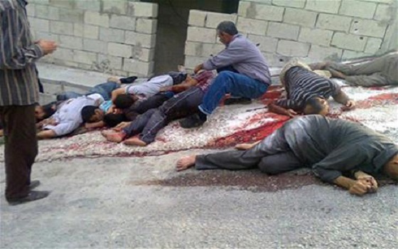   مصر اليوم - انتشار صور على الإنترنت للتعامل الوحشي مع جثث مقاتلي المعارضة الـ152 في ريف دمشق