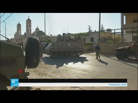 مواطنون يحملون السلاح للدفاع عن بلدة القاع اللبنانية
