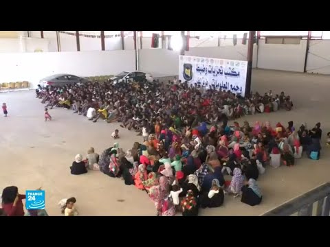 شاهد آلاف المهاجرين محاصرون وسط اشتباكات دامية في ليبيا