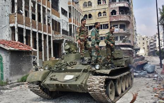 مصر اليوم - الجيش السوري يدخل حمص بعد أنسحاب مقاتلي المعارضة