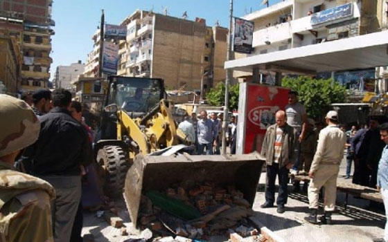   مصر اليوم - عُمَّال محال في بورسعيد يتظاهرون احتجاجًا على الإشغالات