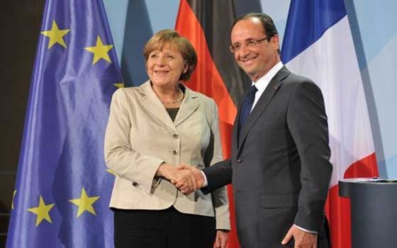   مصر اليوم - هولاند وميركل يحثان بوتين على التوسط لوقف إطلاق النار في أوكرانيا